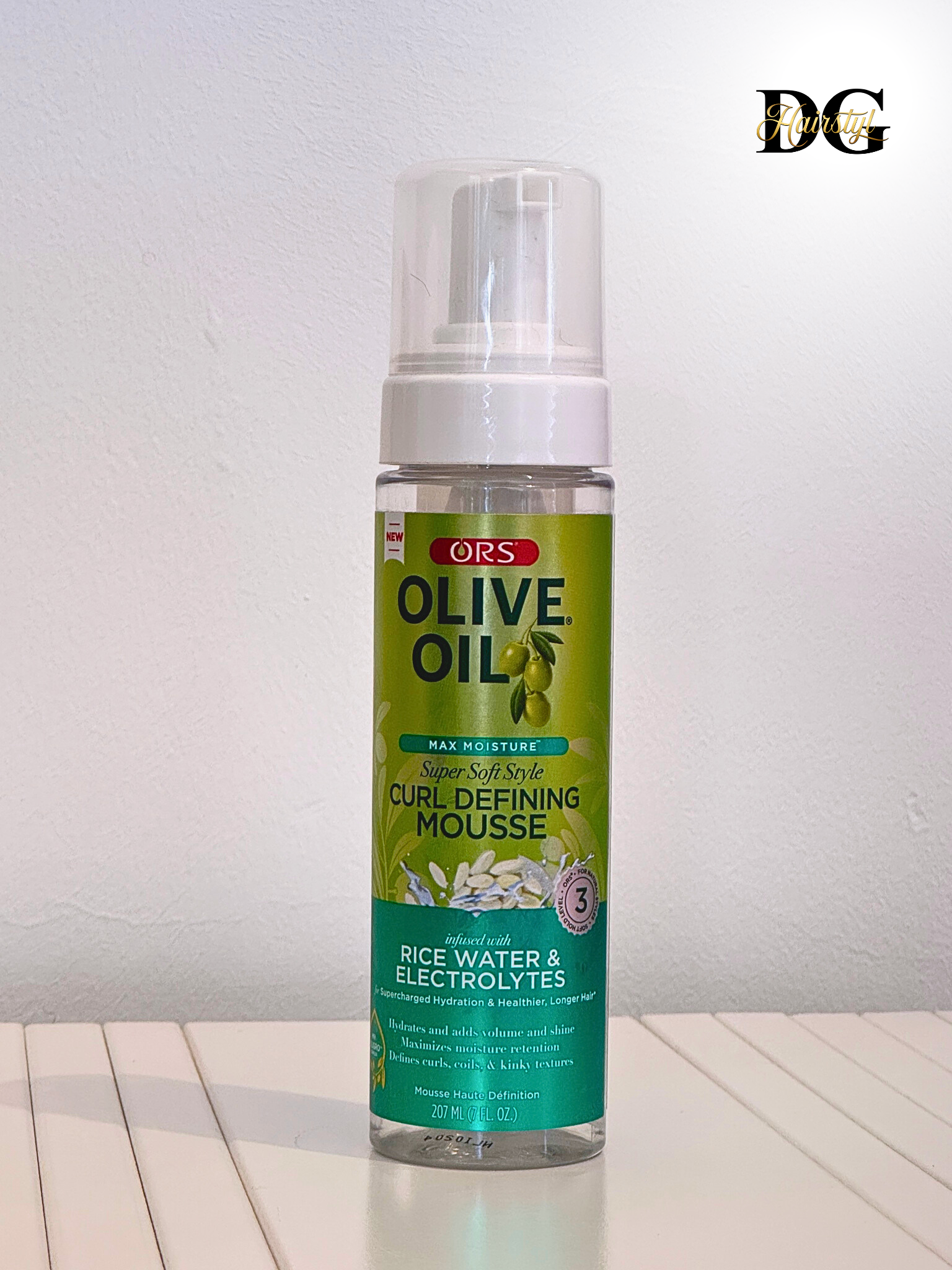 Olive Oil Wrap Set Mousse for wigs and natural hair, controls frizz, adds shine, and provides long-lasting hold, available at DGHairstyl for flawless wig styling